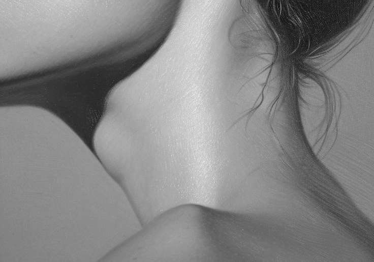 Close-up of a person's neck and shoulder with a blurred background